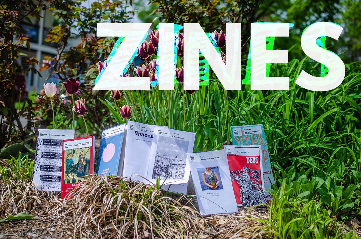 Zines and flowers outside of the library. The title of the images says "zines"