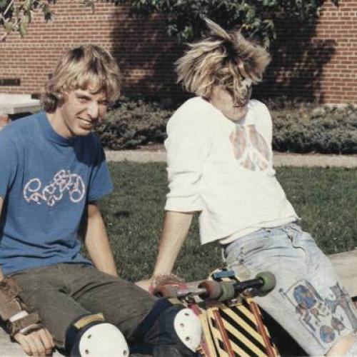 Two students with skateboards at Bloomington High School South, 1986