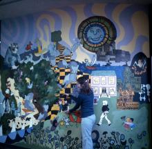 Georgia (Flaten) Shaw with mural in Children's department