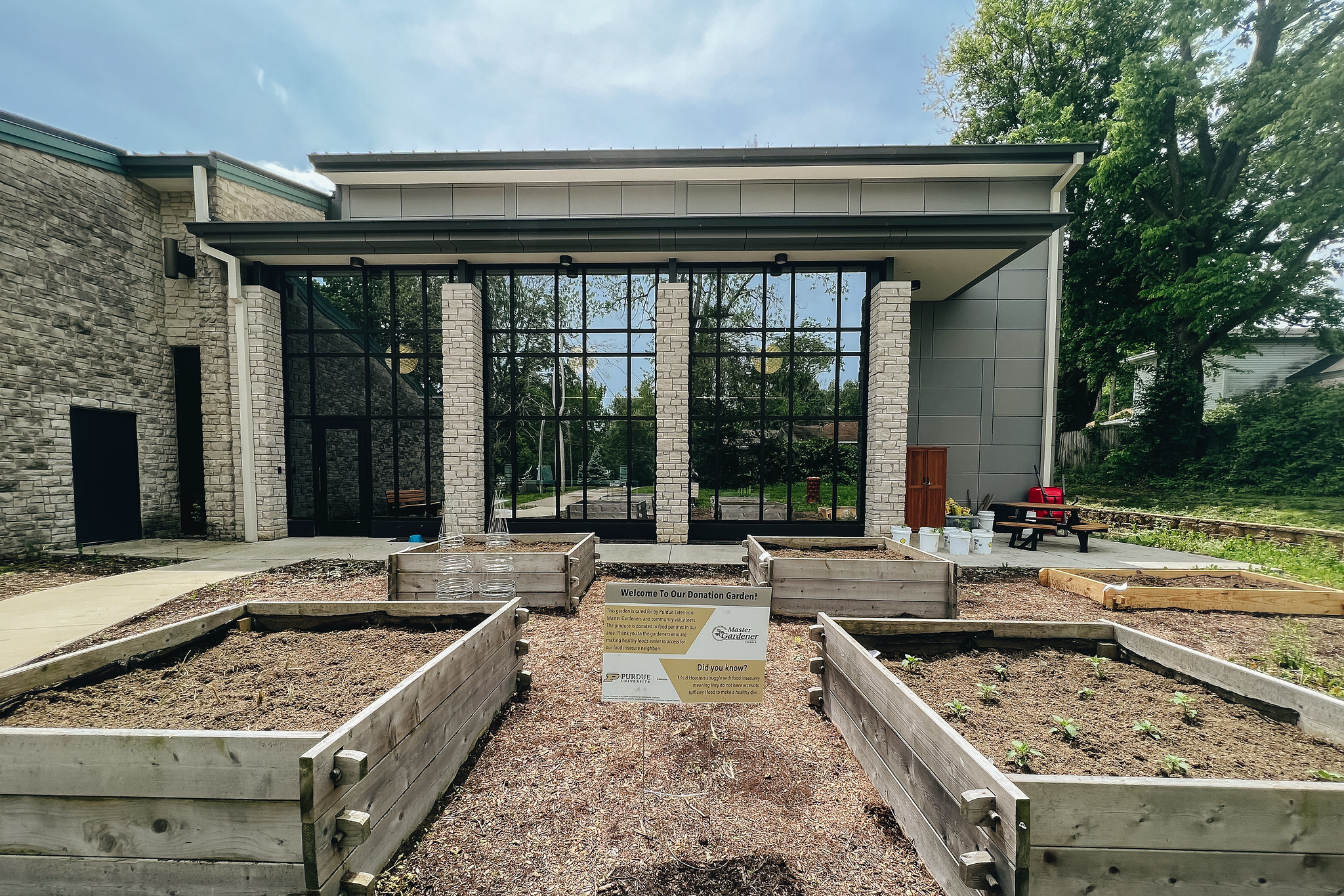 A photo of four raised garden beds outside of the Ellettsville Branch. 