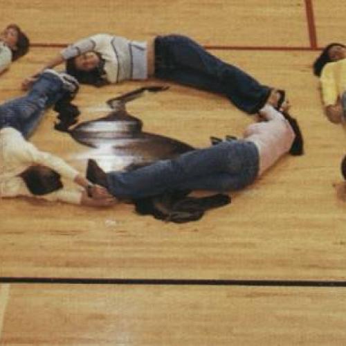 Edgewood High students lying on the gym floor to spell you, 2001