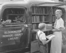 Miss Lois Henze with the Library's first bookmobile.